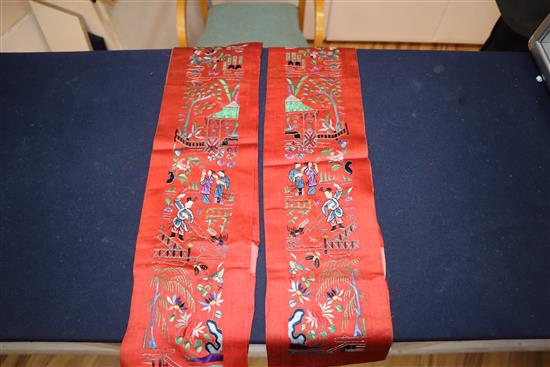 A Chinese silk embroidered hanging and a collection of embroidered sleeve bands and panels